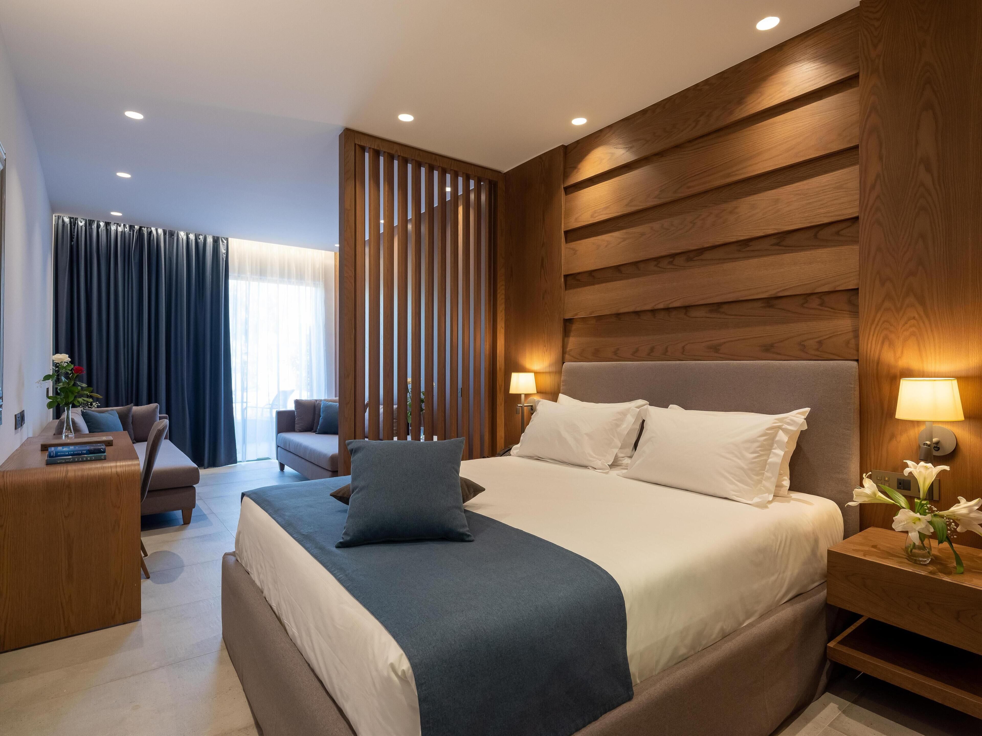 Comfort Quadruple Room, Garden View | Free minibar, in-room safe, blackout drapes, soundproofing