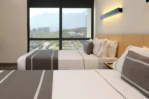 Room, 2 Double Beds | In-room safe, desk, blackout drapes, iron/ironing board