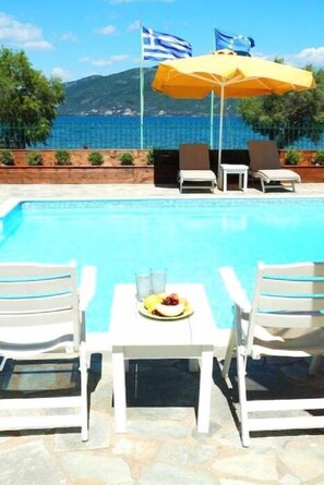 Outdoor pool, pool umbrellas, pool loungers