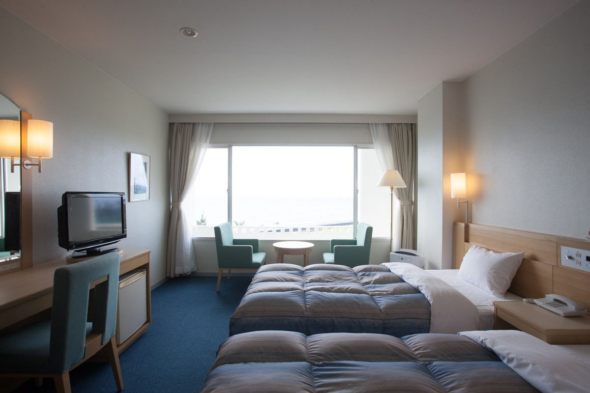 Chambre avec lits jumeaux, vue océan