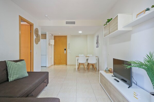 Apartment, 2 Bedrooms (6p) | Living area | Flat-screen TV