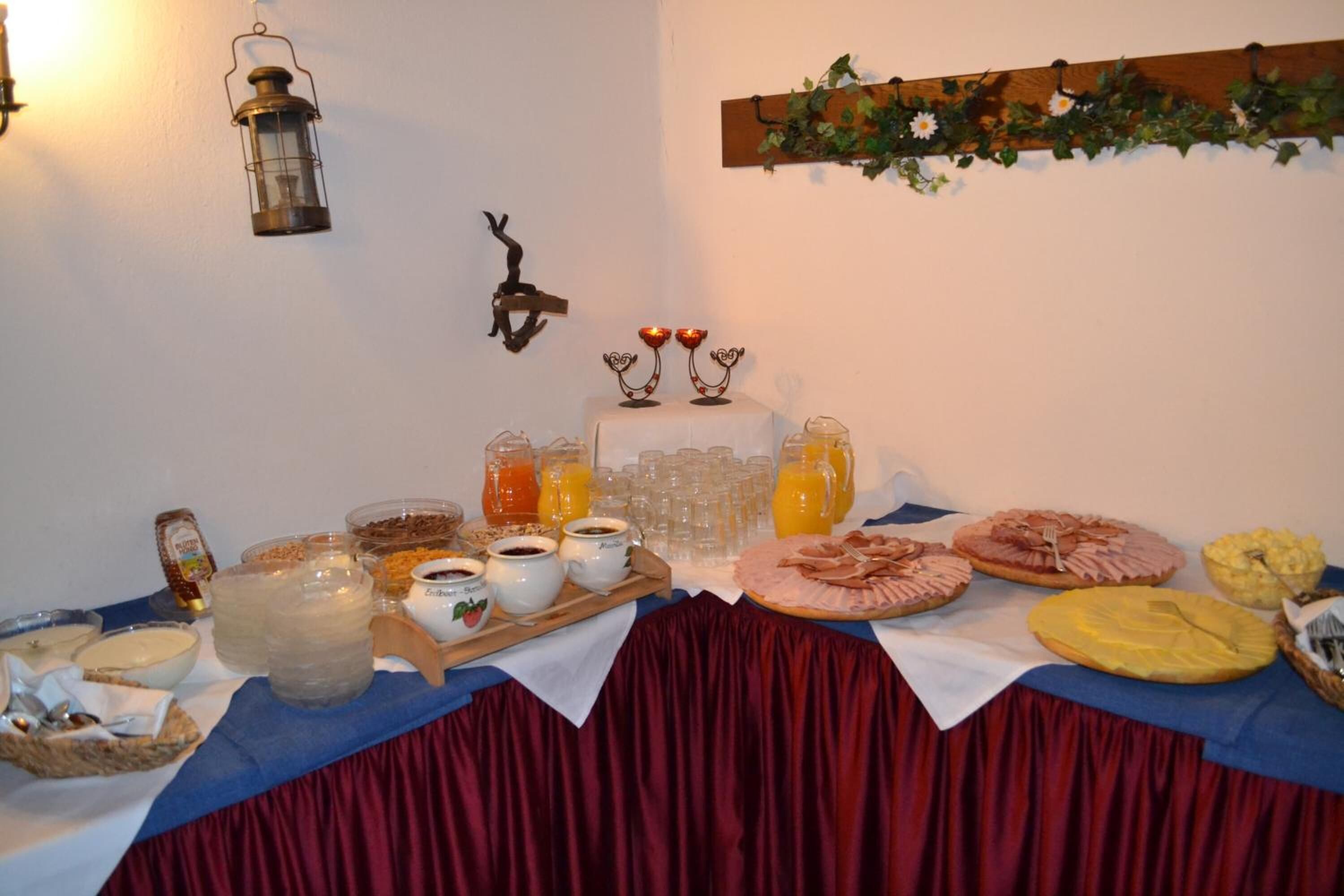 A breakfast buffet with various food items and beverages.