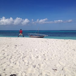 On the beach, white sand, sun loungers, beach umbrellas