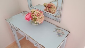 A vintage-style dresser with floral patterns and a mirror above it. - Elaias Gi Residence (Kefalonia)