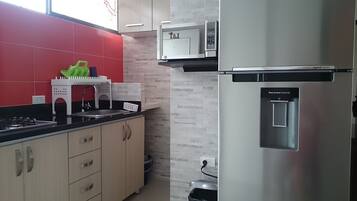 Apartment, 2 Bedrooms | Private kitchen | Full-size fridge, microwave, stovetop, cookware/dishes/utensils