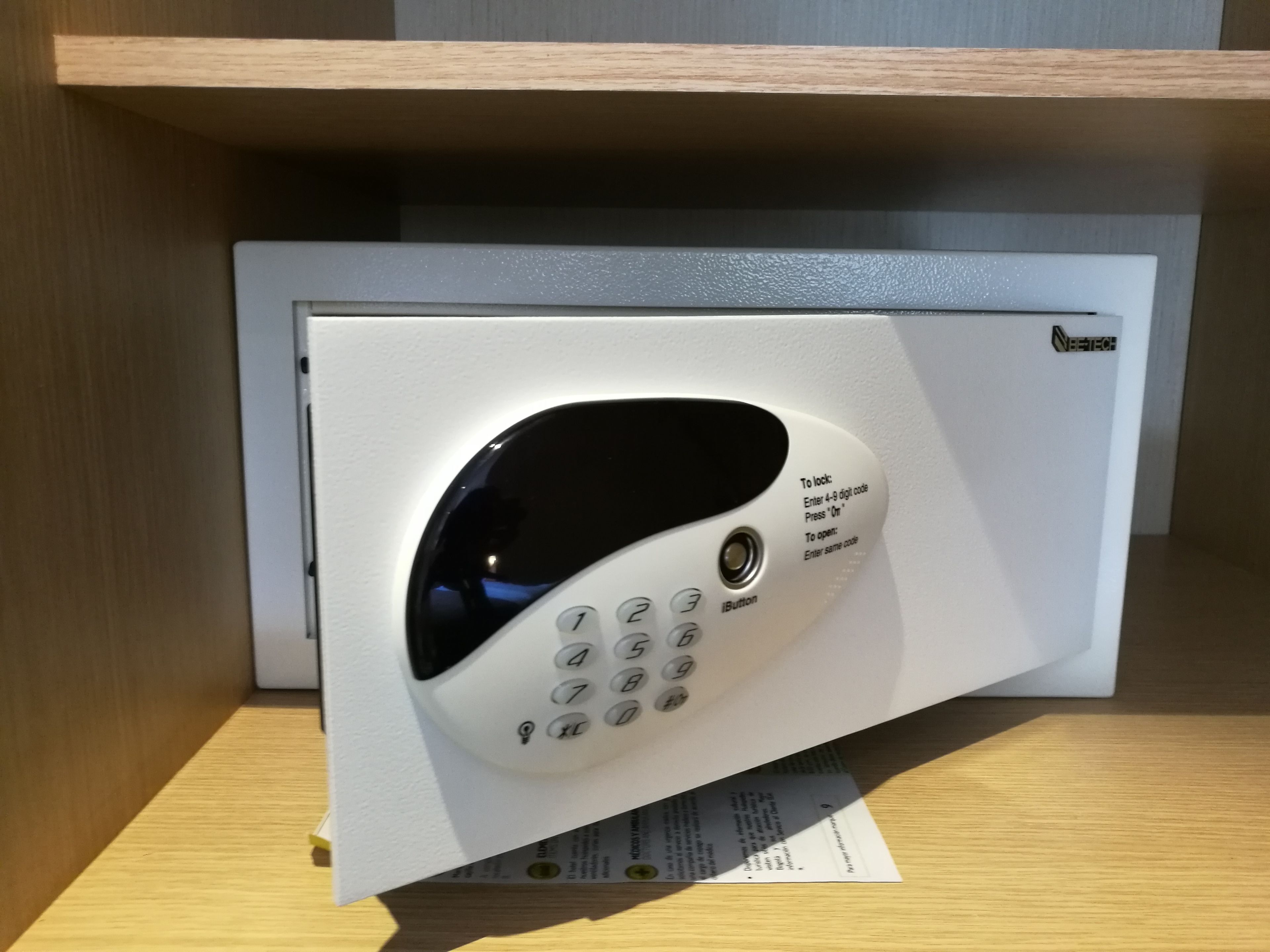 A keypad entry device with instructions for locking and unlocking.