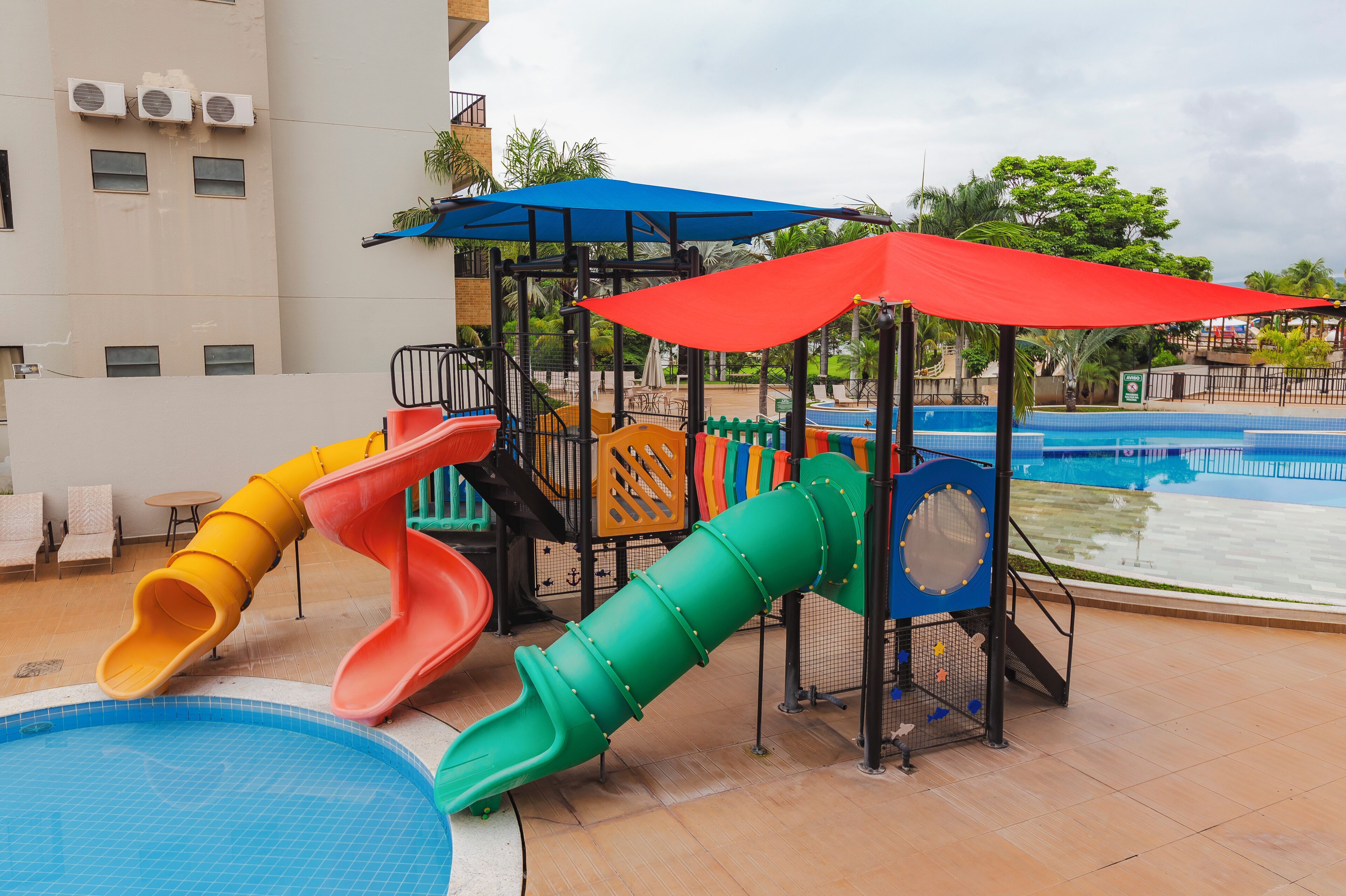 A children's play area with multiple slides and a pool.