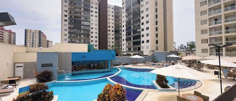 Indoor pool, 5 outdoor pools, open 6:00 AM to midnight, pool umbrellas