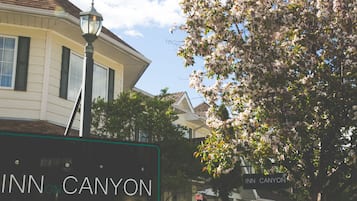 A street view with a sign for 'Inn on Canyon'.