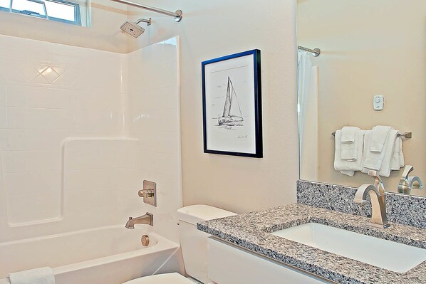 A modern bathroom with a bathtub, a sink, and a shower. - Oyhut Bay Resort (Ocean Shores)