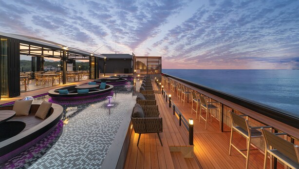 A cruise ship deck with outdoor seating, a pool, and a view of the ocean at sunset. - Hotel Two - Y (Yangyang)