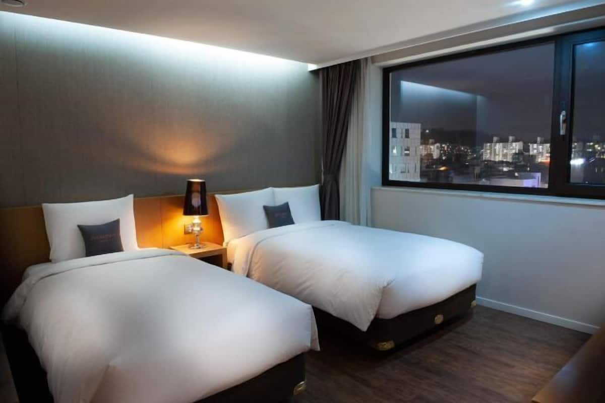 Premium bedding, down duvets, in-room safe, desk