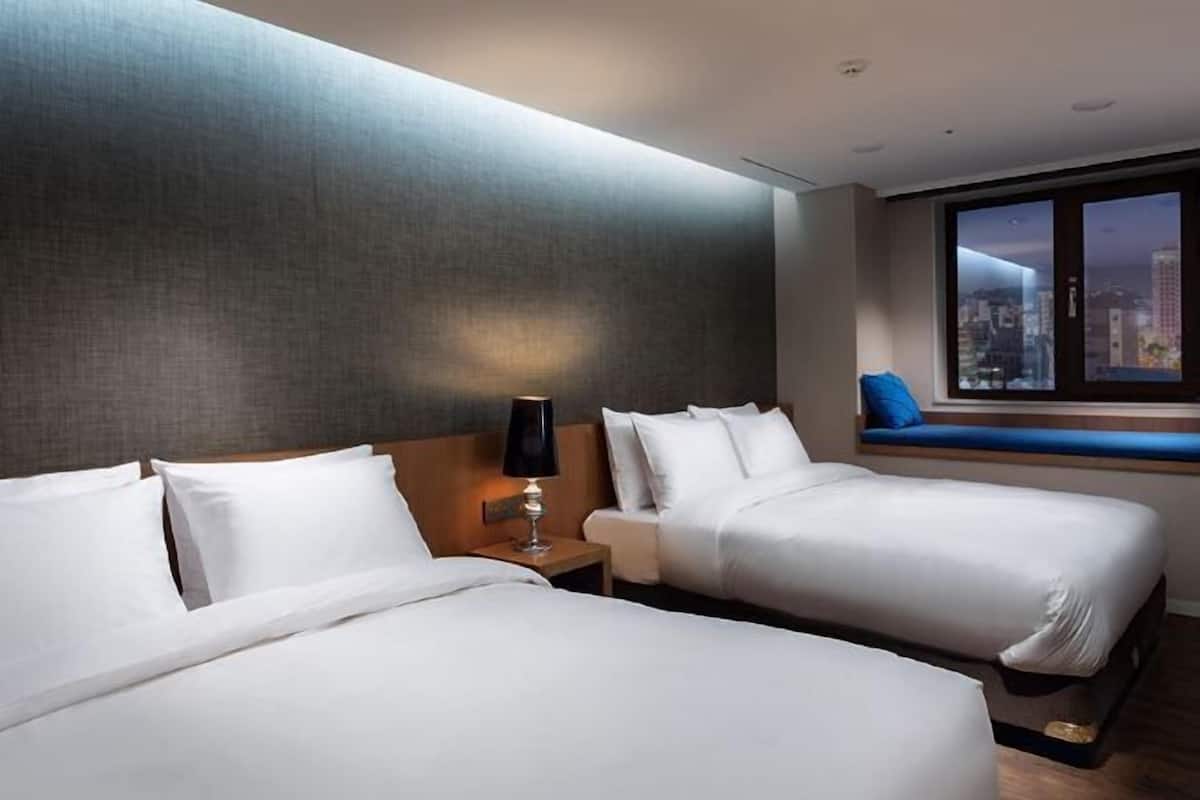 Premium bedding, down duvets, in-room safe, desk