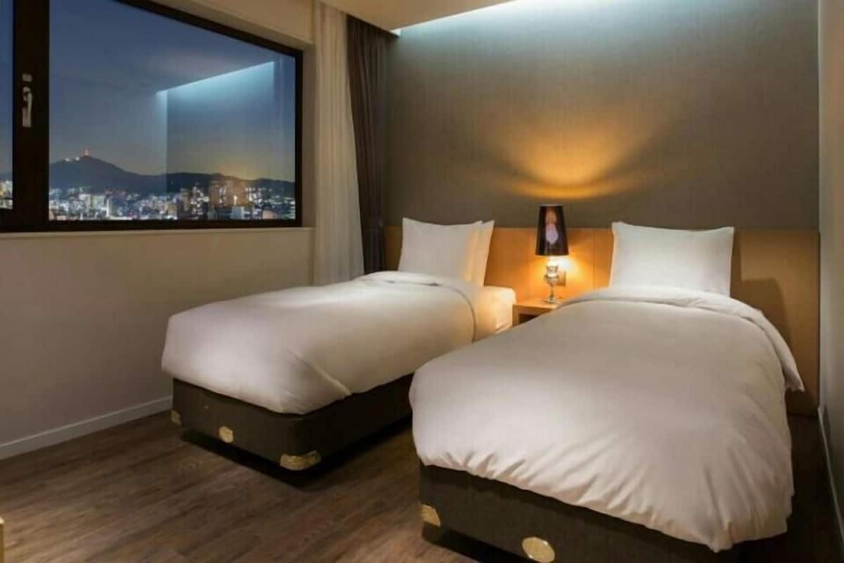 Premium bedding, down duvets, in-room safe, desk