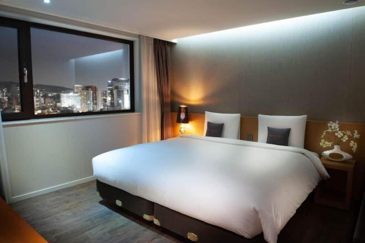 Premium bedding, down duvets, in-room safe, desk