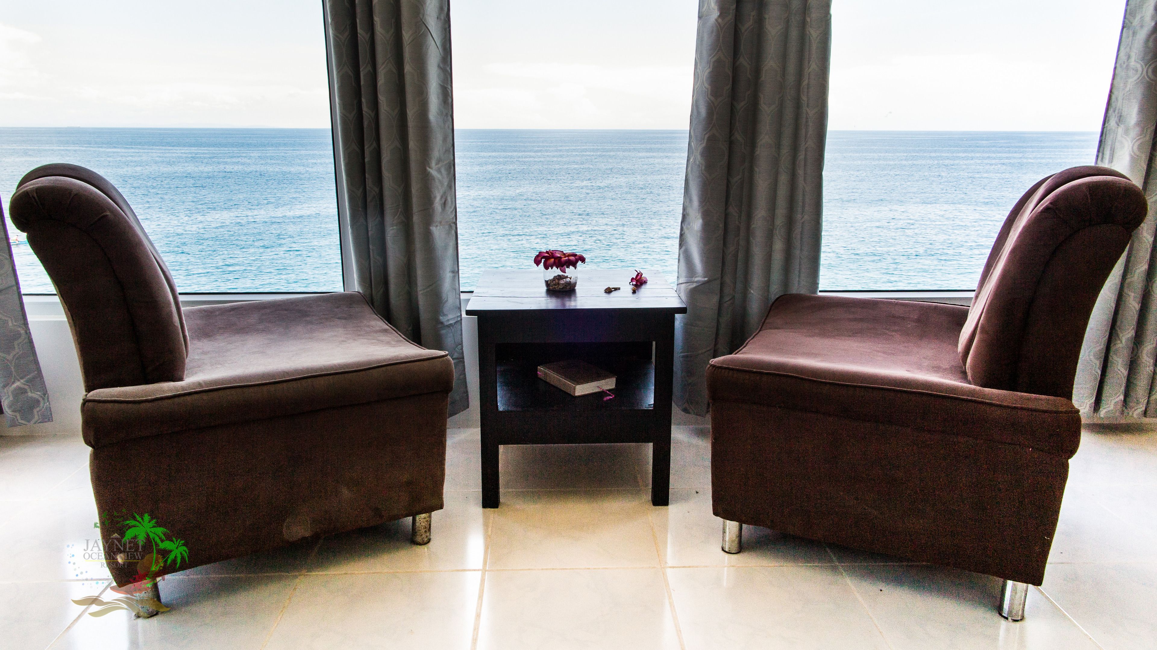 family room, 2 queen beds, ocean view | living area | tv