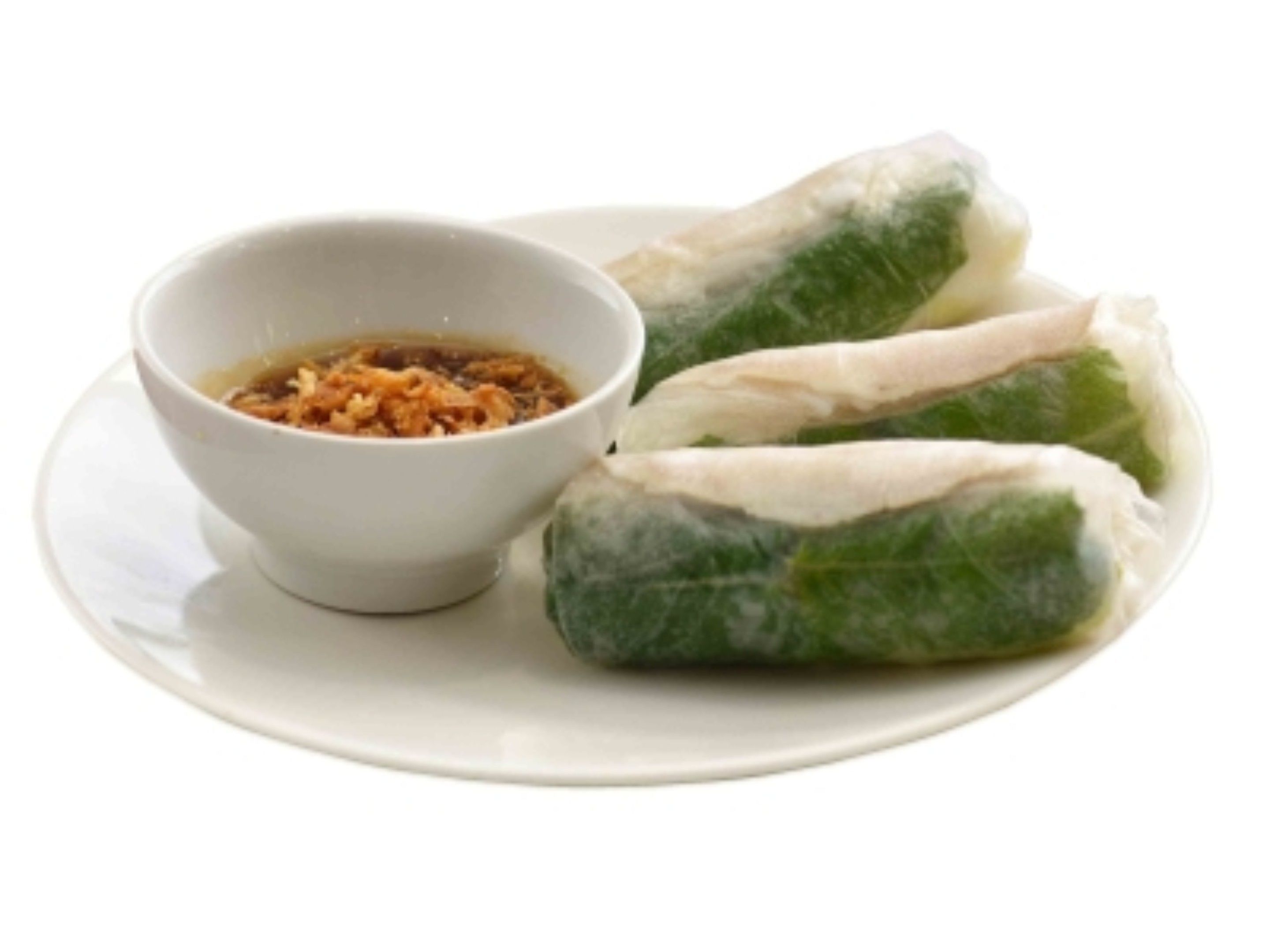 A plate with three spring rolls and a small bowl of dipping sauce.
