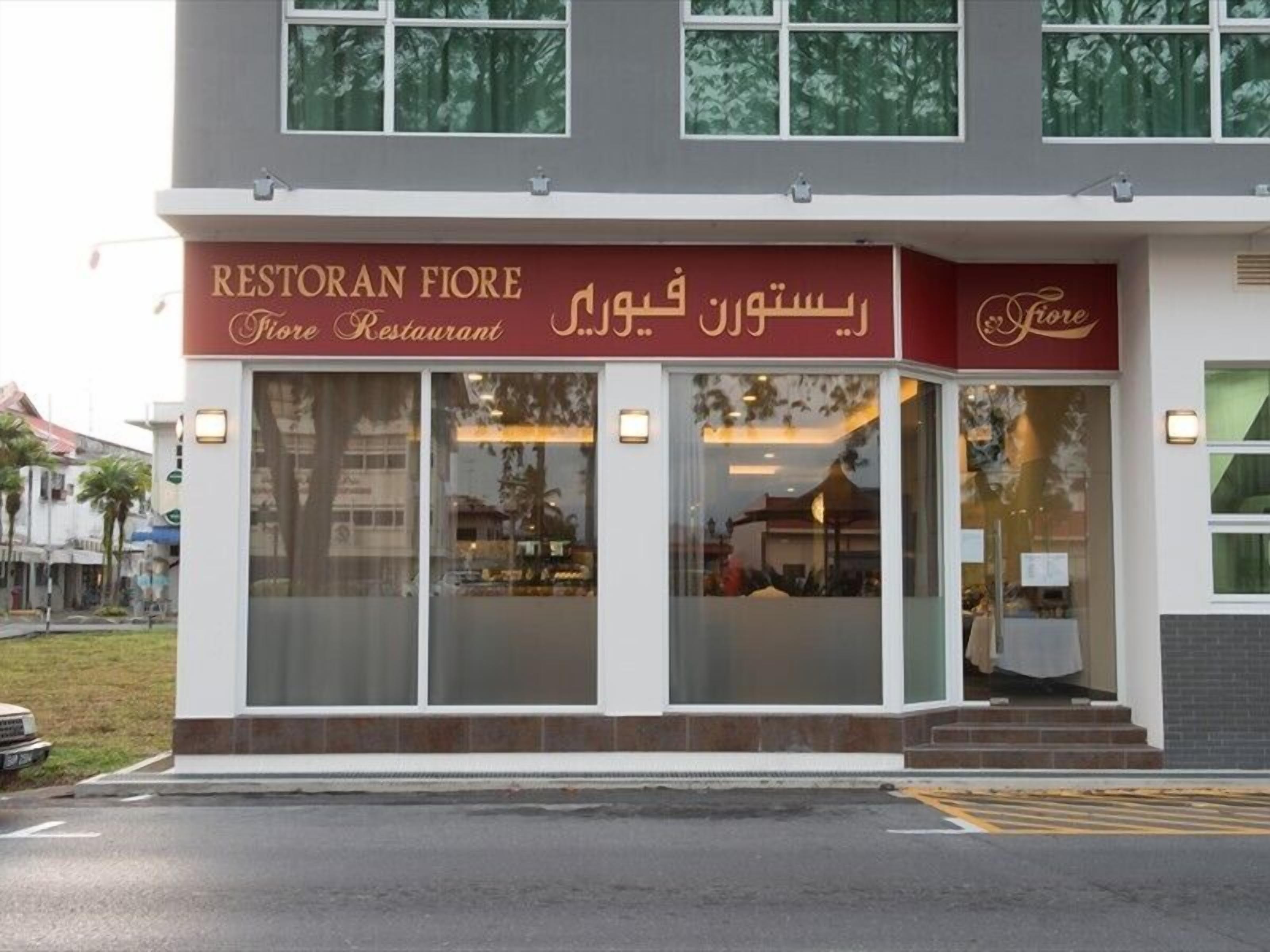 A two-story building with a storefront labeled "Restoran Fiore Restaurant" and "Fiore."