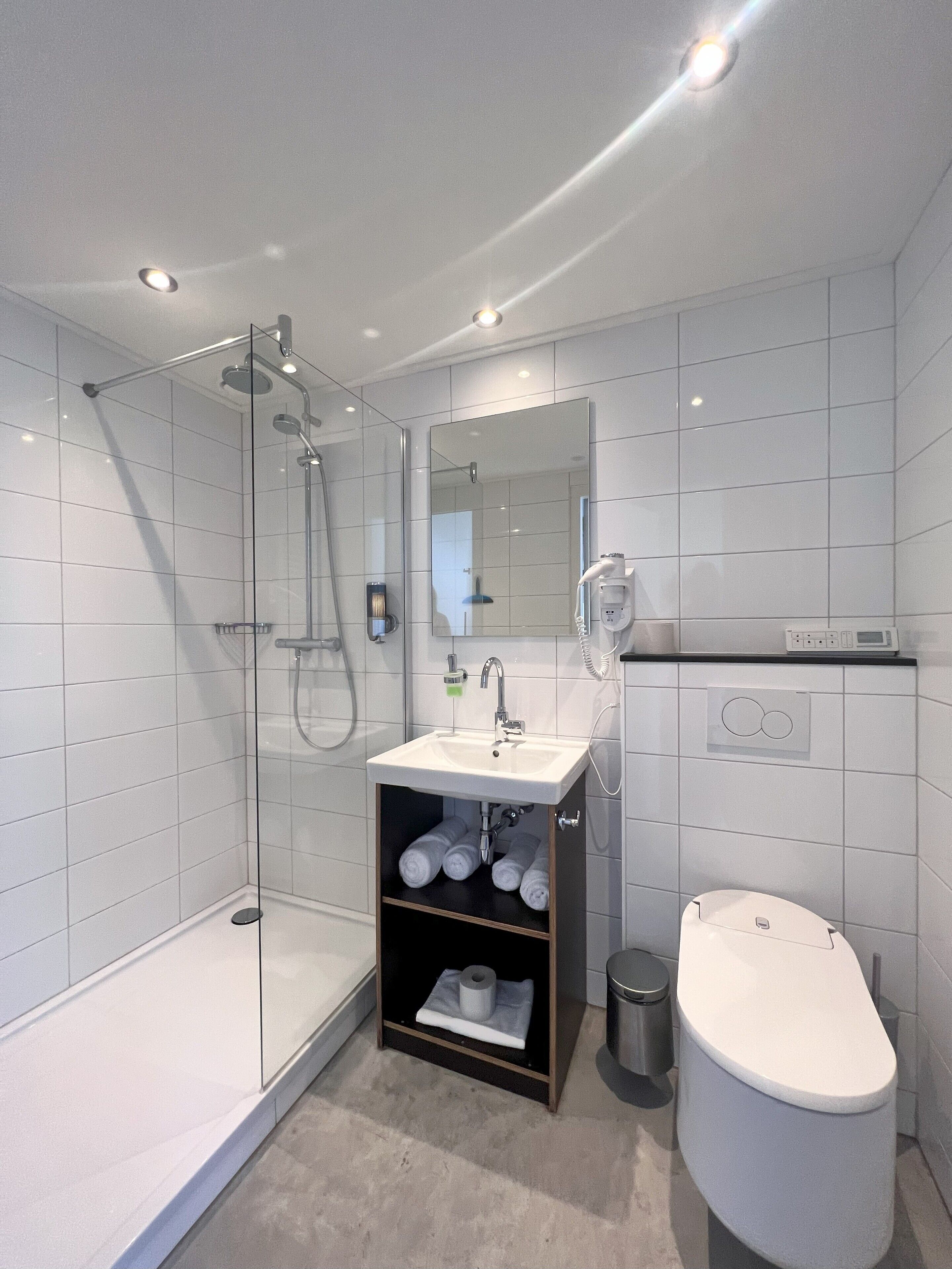 studio | bathroom | shower, rainfall showerhead, designer toiletries, hair dryer