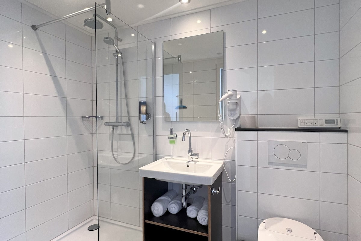 studio | bathroom | shower, rainfall showerhead, designer toiletries, hair dryer