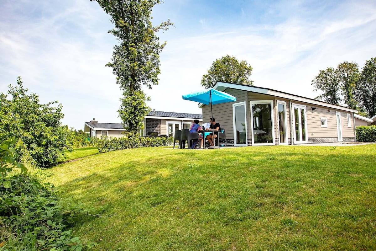 A modern house with a covered patio area.