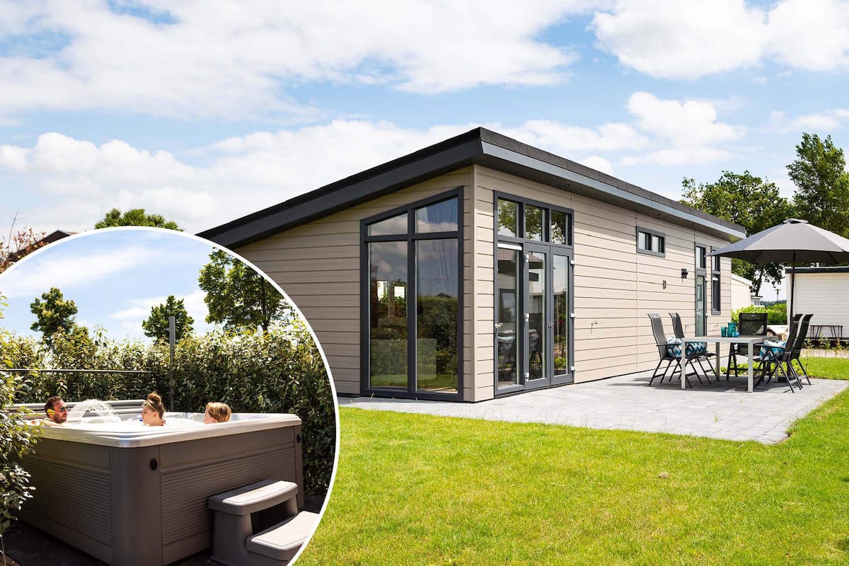 A modern house with a patio, a hot tub, and a dining area with outdoor furniture.