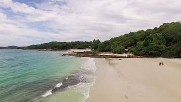 On the beach, white sand, beach towels, scuba diving