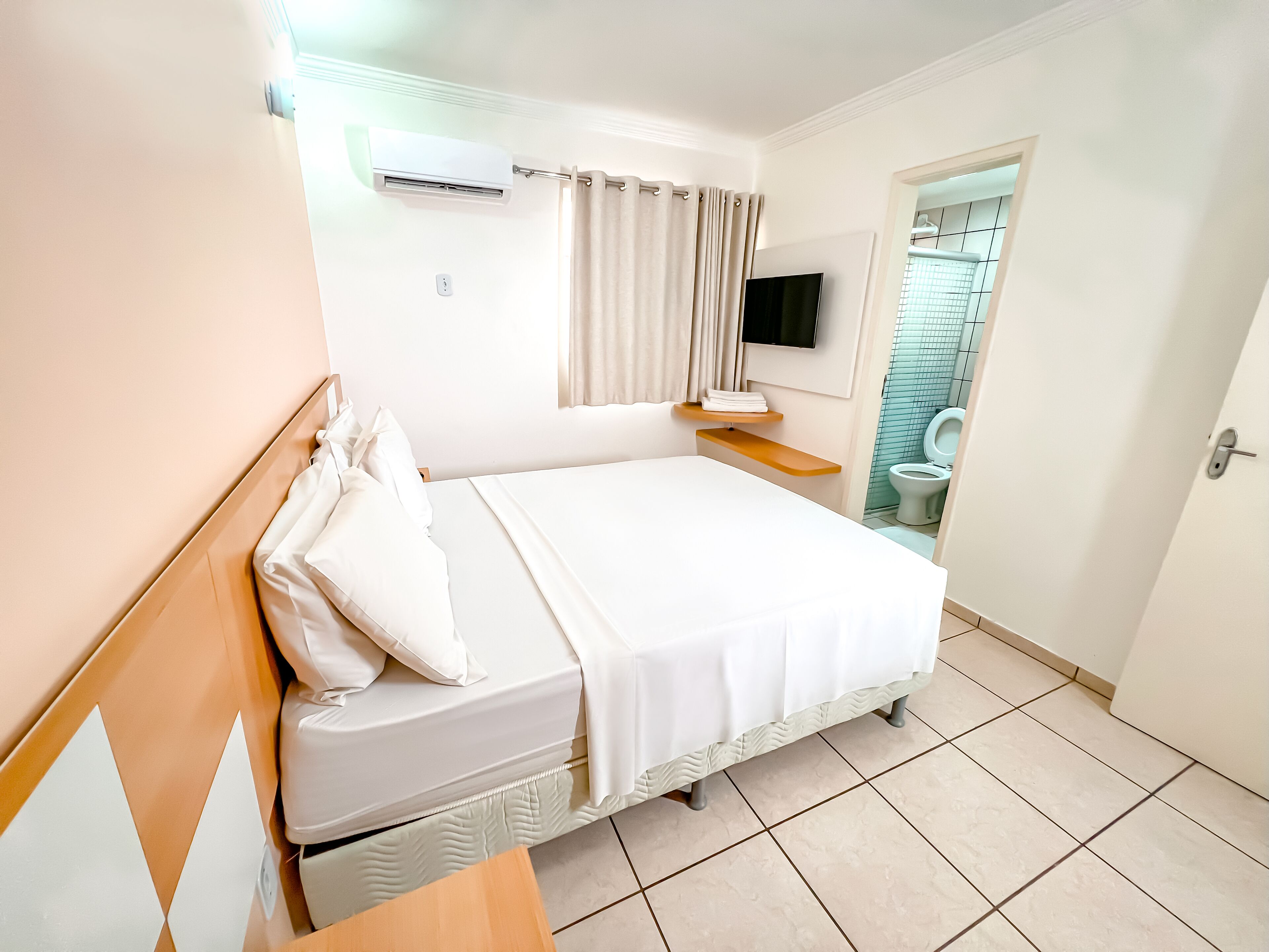 Standard Double Room | Minibar, in-room safe, desk, blackout drapes