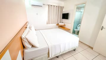 Standard Double Room | Minibar, in-room safe, desk, blackout drapes