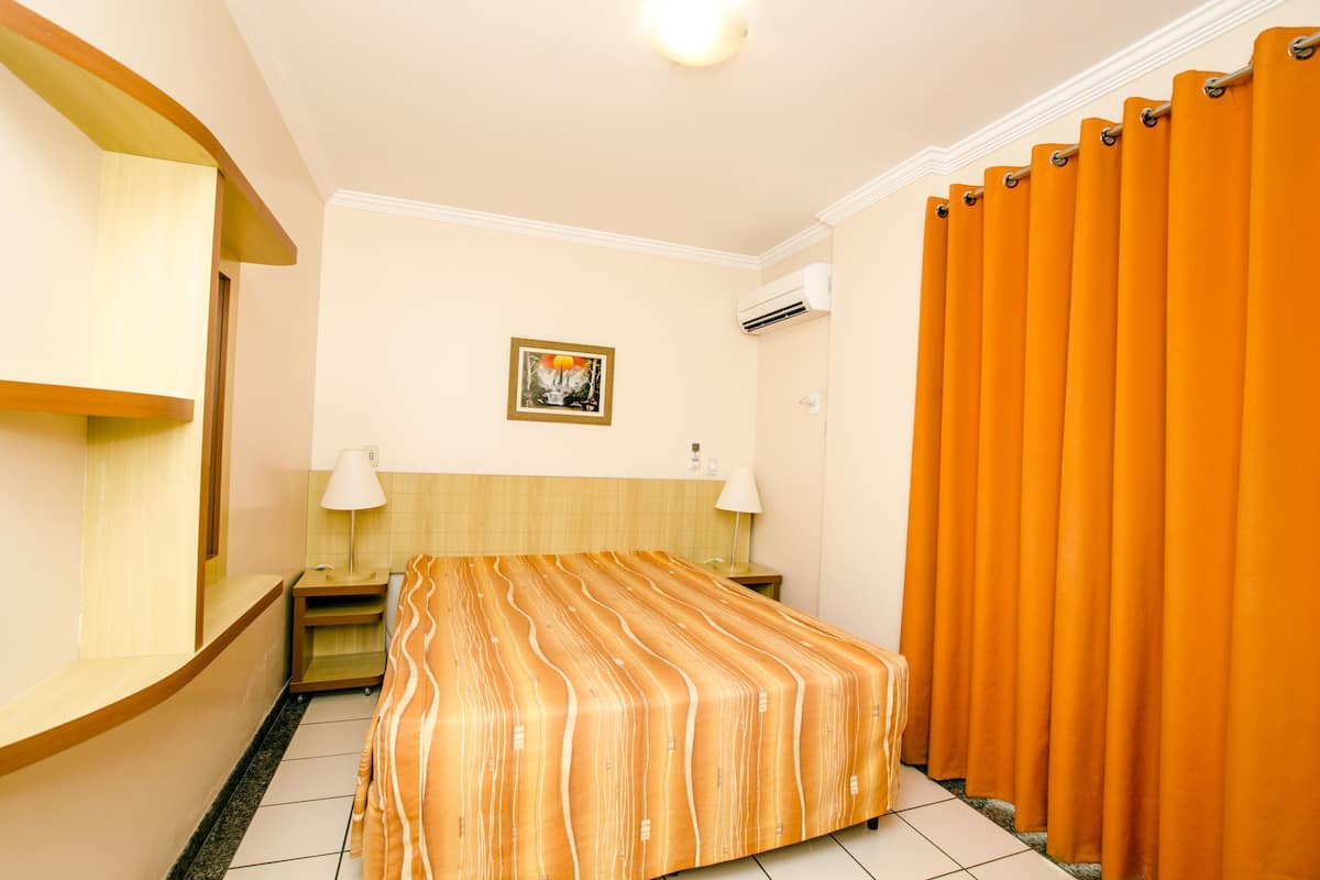 Standard Double Room | Minibar, in-room safe, desk, blackout drapes