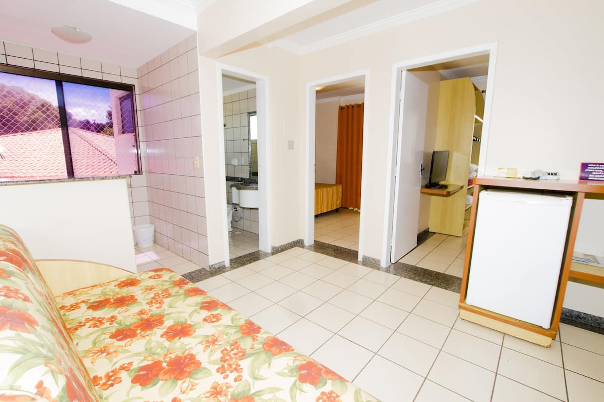 Standard Triple Room | Minibar, in-room safe, desk, blackout drapes