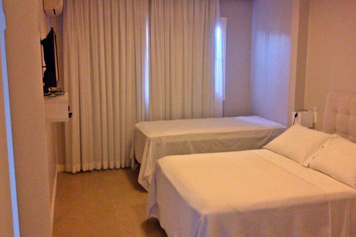 Comfort Triple Room | Minibar, in-room safe, individually decorated, desk