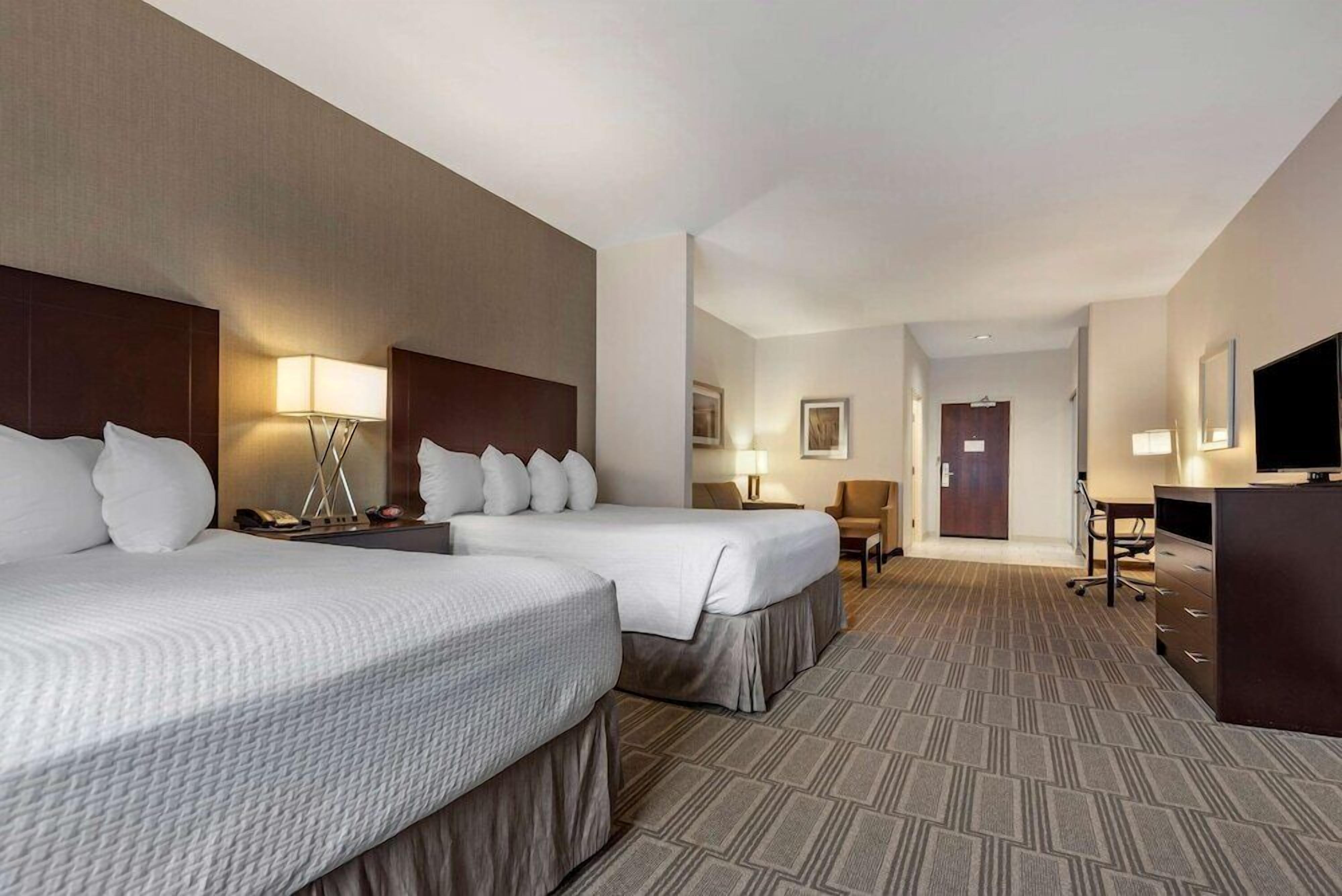 Hypo-allergenic bedding, pillowtop beds, desk, laptop workspace