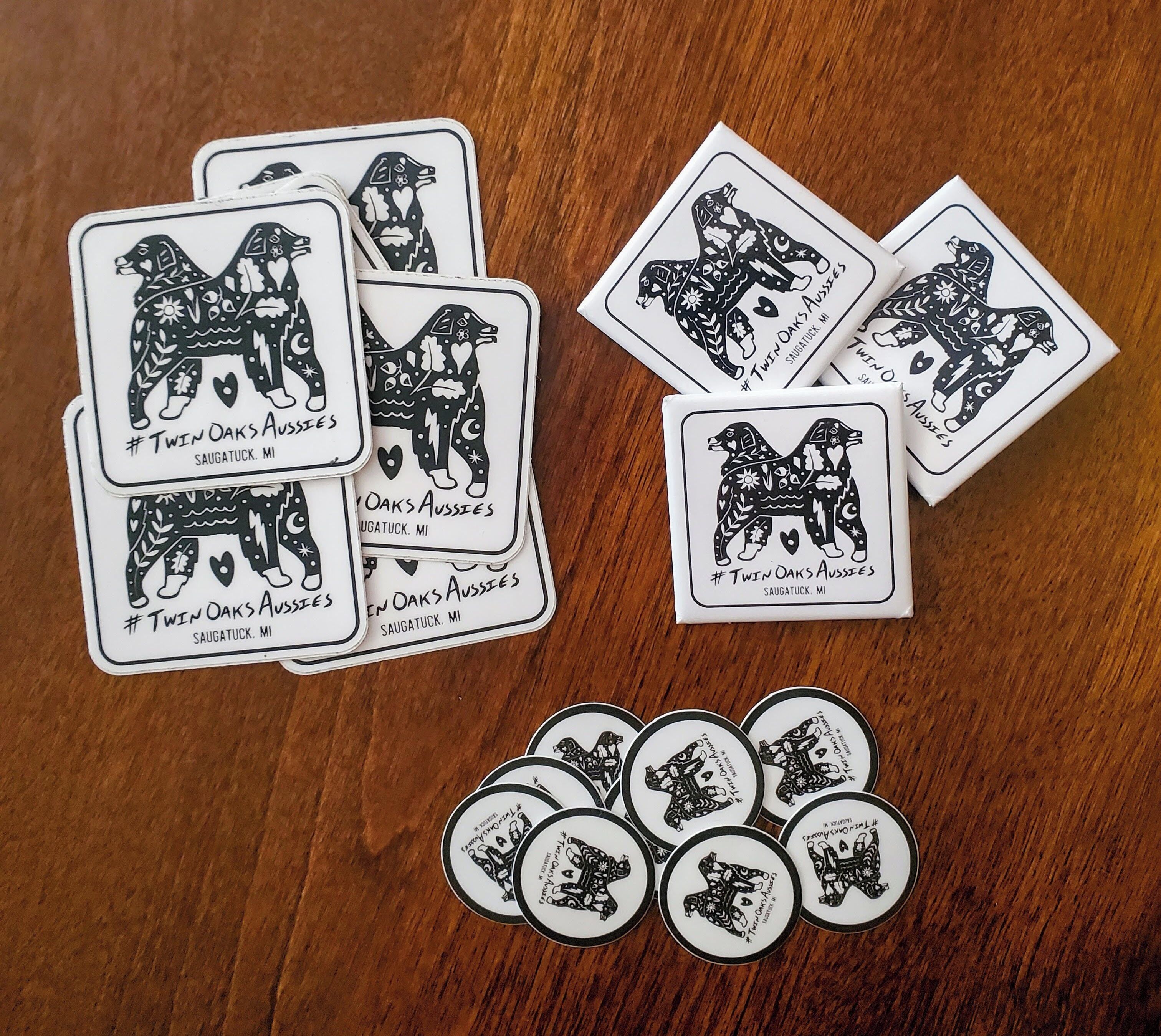 A collection of playing cards and poker chips with a dog design, arranged on a wooden surface.