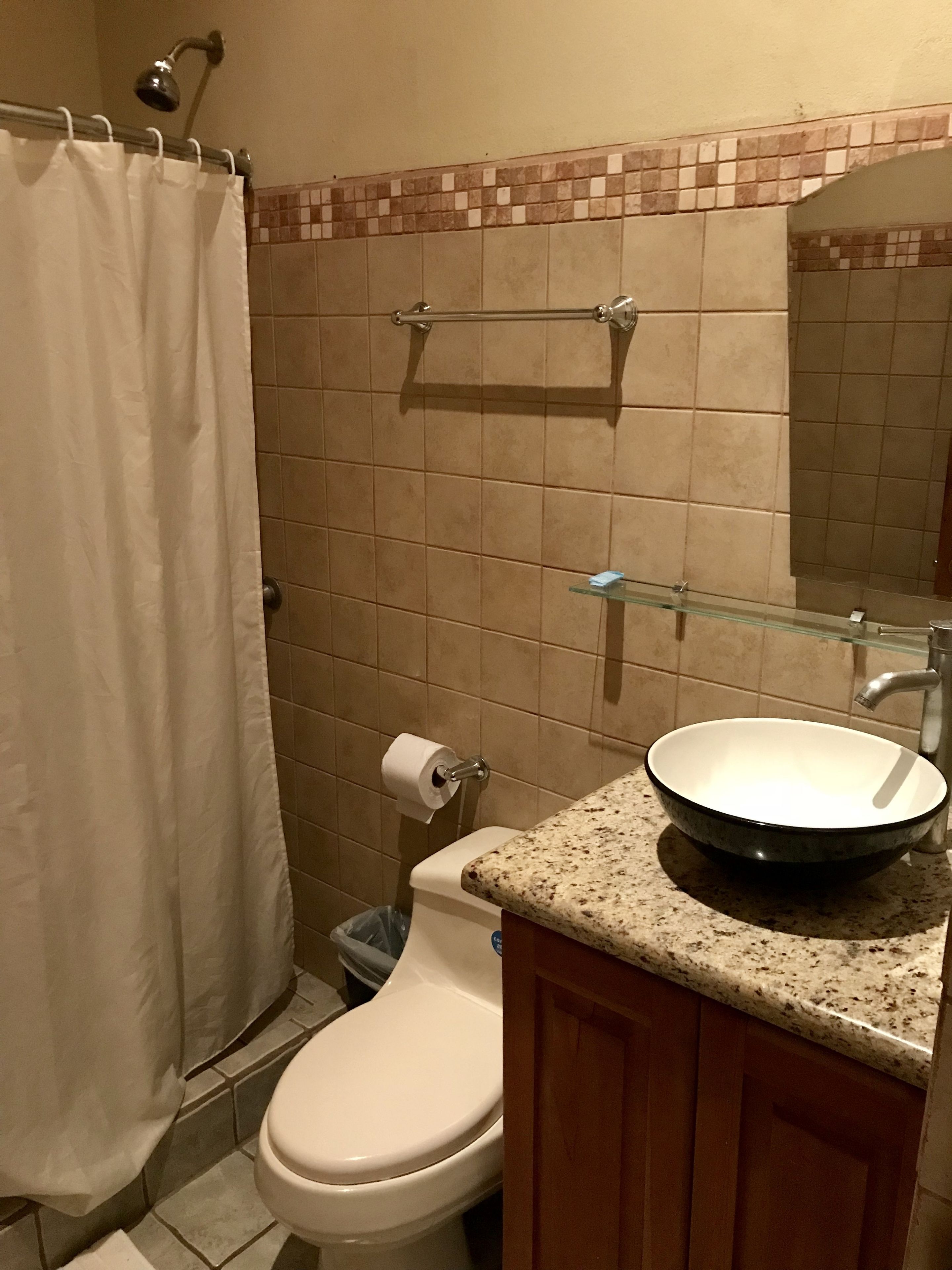 shower, rainfall showerhead, eco-friendly toiletries, towels