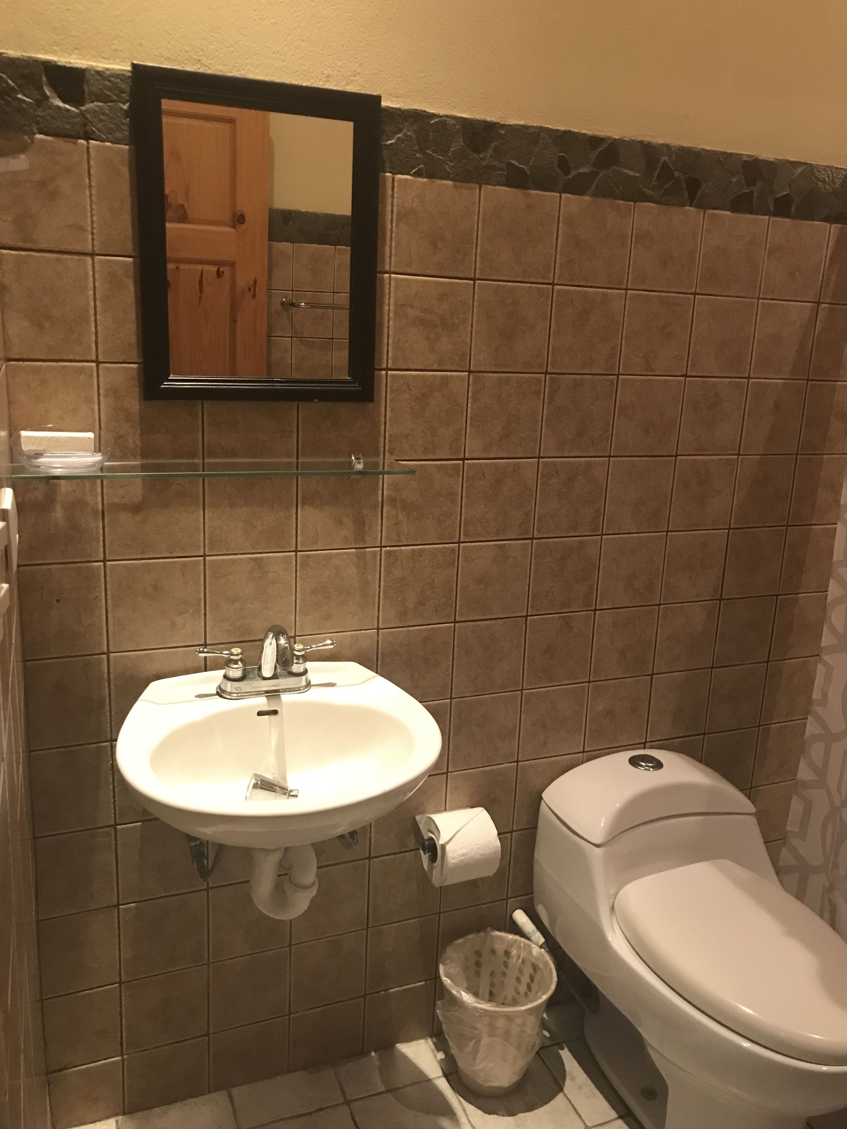 shower, rainfall showerhead, eco-friendly toiletries, towels