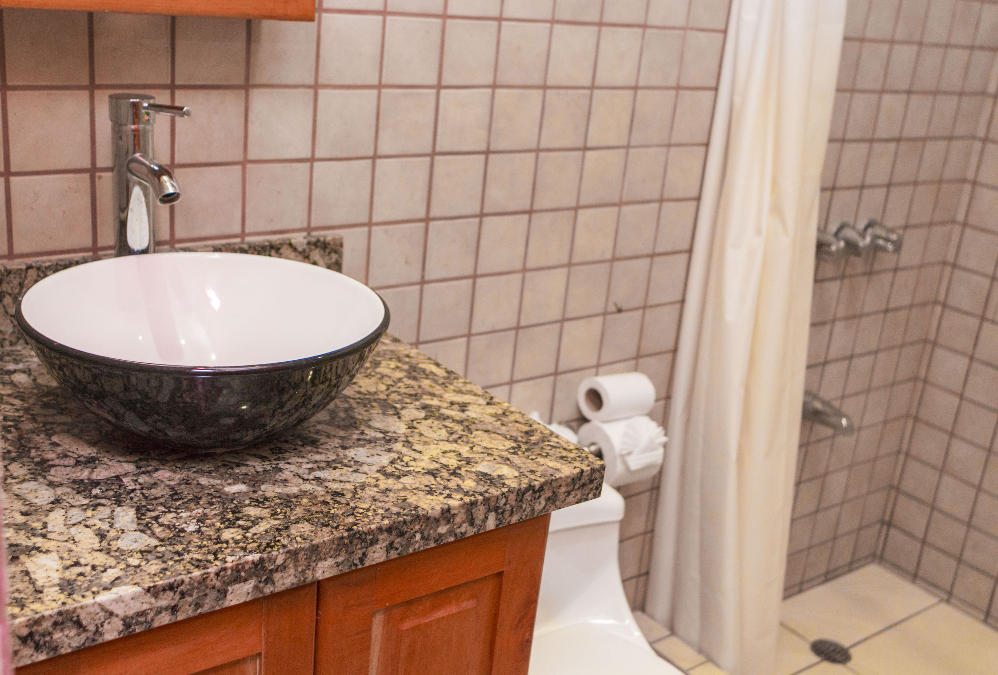 shower, rainfall showerhead, eco-friendly toiletries, towels