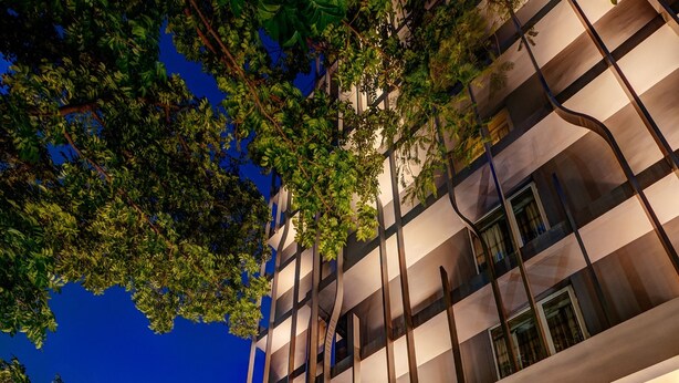 A modern hotel entrance with a large marble reception desk, a well-lit facade, and a sign reading "The Way Dhaka." - THE WAY Dhaka (Dhaka)