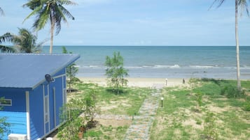 On the beach, sun-loungers, beach umbrellas, beach towels