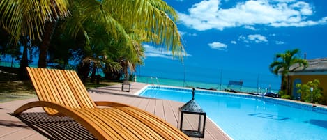 Outdoor pool, pool umbrellas, sun loungers