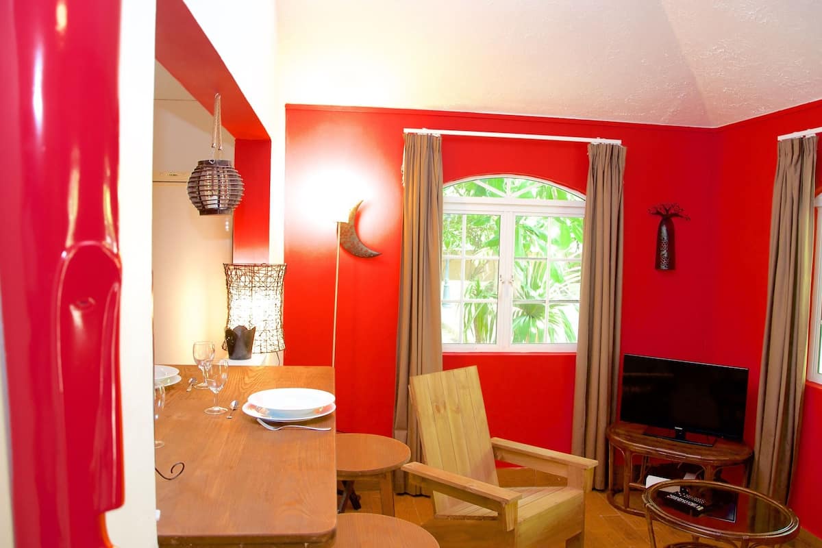 Family Bungalow, Kitchenette, Garden View | Living area | Flat-screen TV