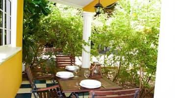 Family Bungalow, Kitchenette, Garden View | Breakfast area | Free daily English breakfast