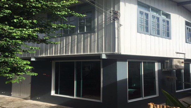 A modern two-story building with large windows and a flat roof. - Nicha Homestay Huahin (Hua Hin)