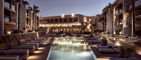 Indoor pool, outdoor pool, pool umbrellas, pool loungers