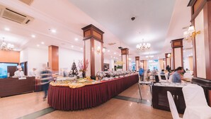 A spacious hotel lobby with a long buffet table, multiple seating areas, and a reception desk. - Saigon Dalat Hotel (Xuan Huong - Da Lat)