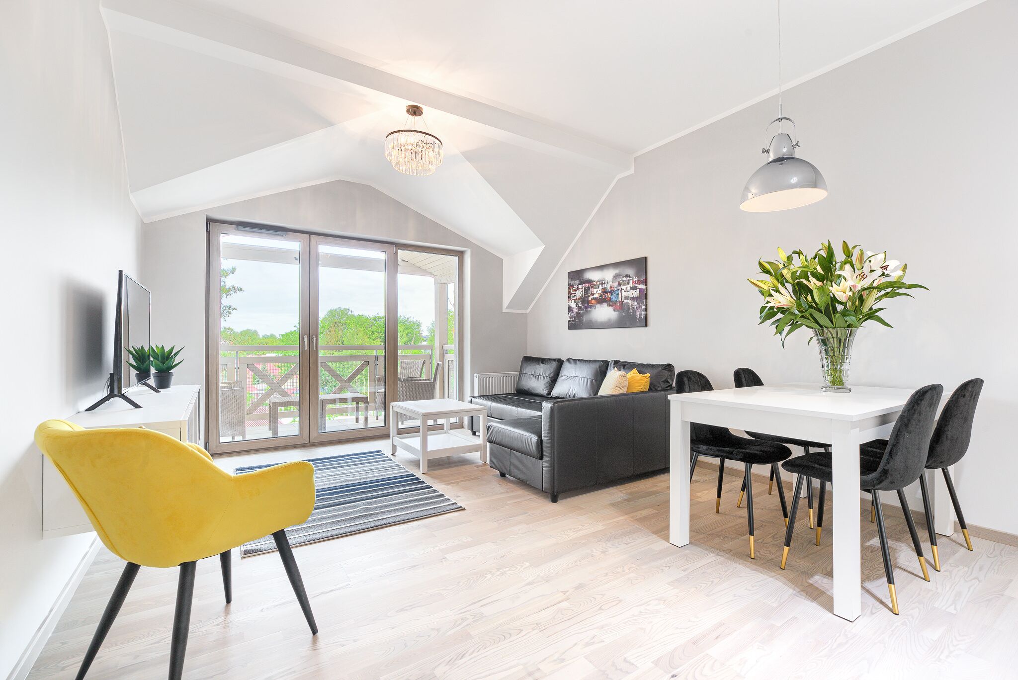 A modern living room with a dining area, a sofa, a yellow chair, and a table with chairs.