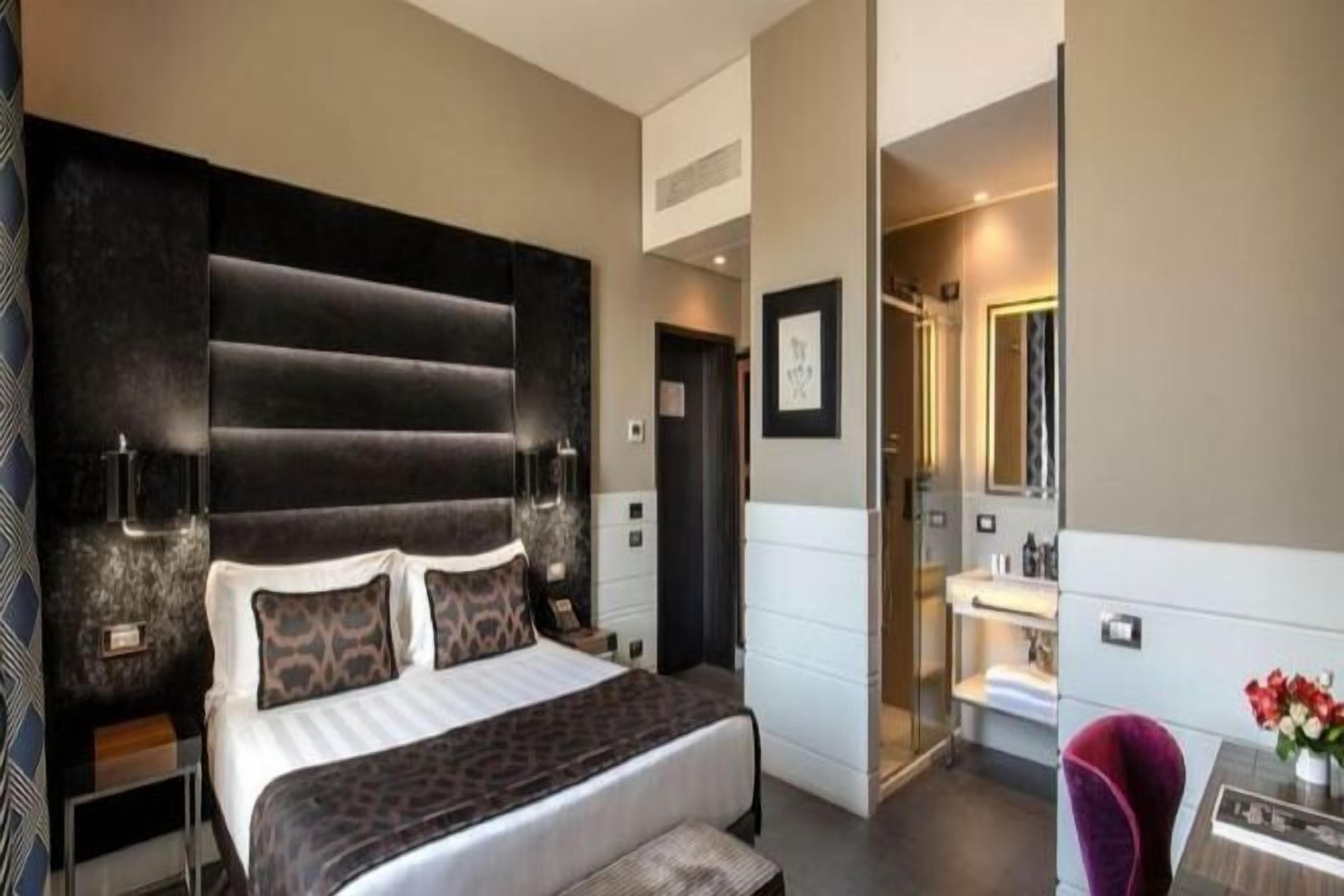 Premium bedding, down comforters, minibar, in-room safe