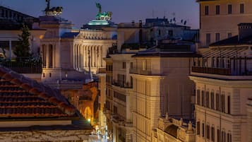 A historic building with classical architecture, including columns and statues.