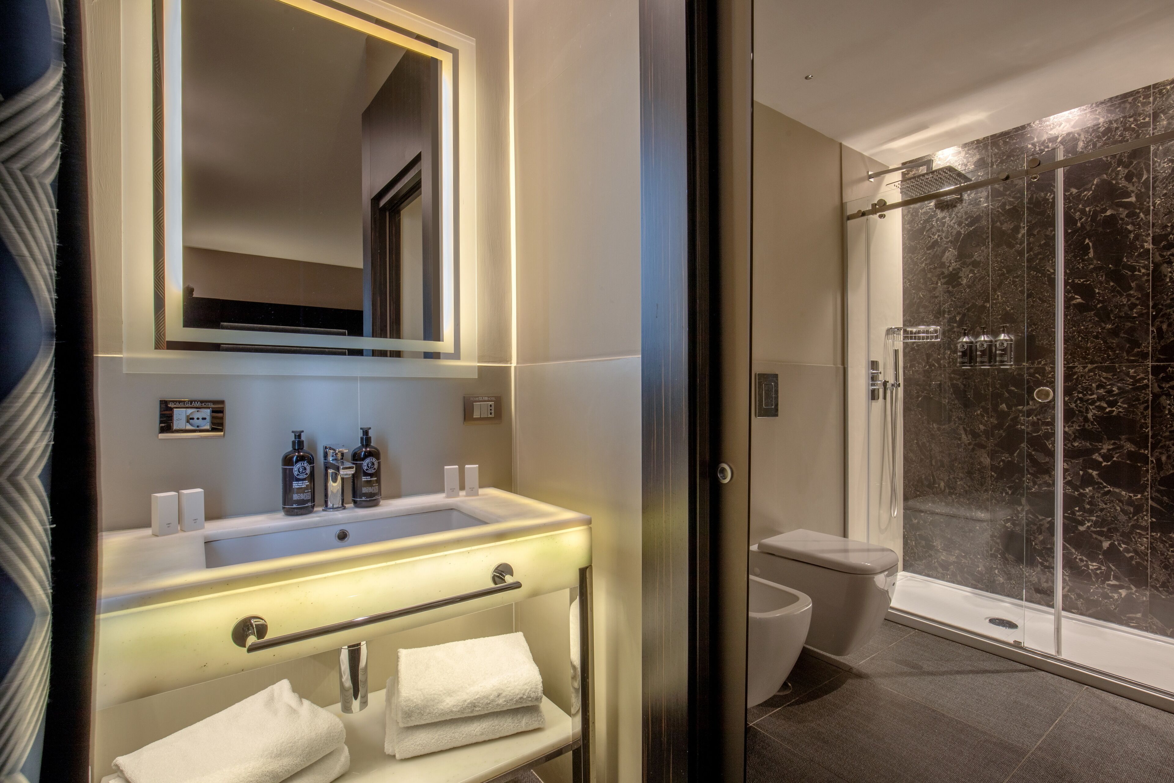 suite | bathroom | eco-friendly toiletries, hair dryer, towels