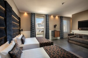 Premium bedding, down duvets, minibar, in-room safe